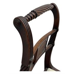 Set of four Regency mahogany dining chairs, rope twist and bead turned cresting rail over reeded middle rail, upholstered drop-in seat, reeded frame and sabre supports