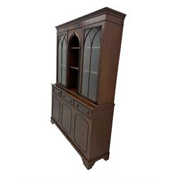 Georgian design mahogany bookcase on cupboard, projecting moulded and dentil cornice, two display cabinets enclosed by glazed doors above over three drawers and three cupboards, on bracket feet