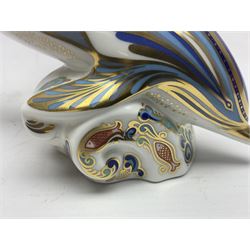 Three Royal Crown Derby paperweights, comprising Bottlenose Dolphin, Baby Bottlenose Dolphin and Striped Dolphin, all with gold stoppers 