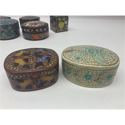 Twelve lacquered boxes, to include square and oval examples, with floral decorations, tallest H5cm