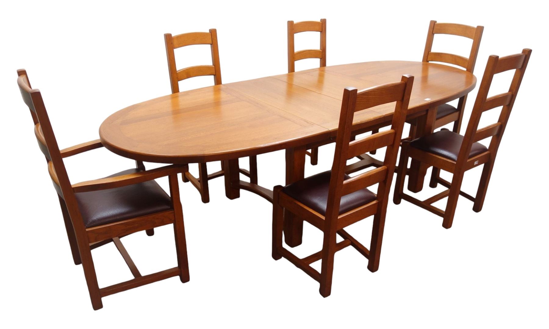 French solid oak oval extending dining table with two leaves, square supports joined by curved 'H' stretcher; set of six (4+2) ladder back chairs with upholstered seats (W59cm)