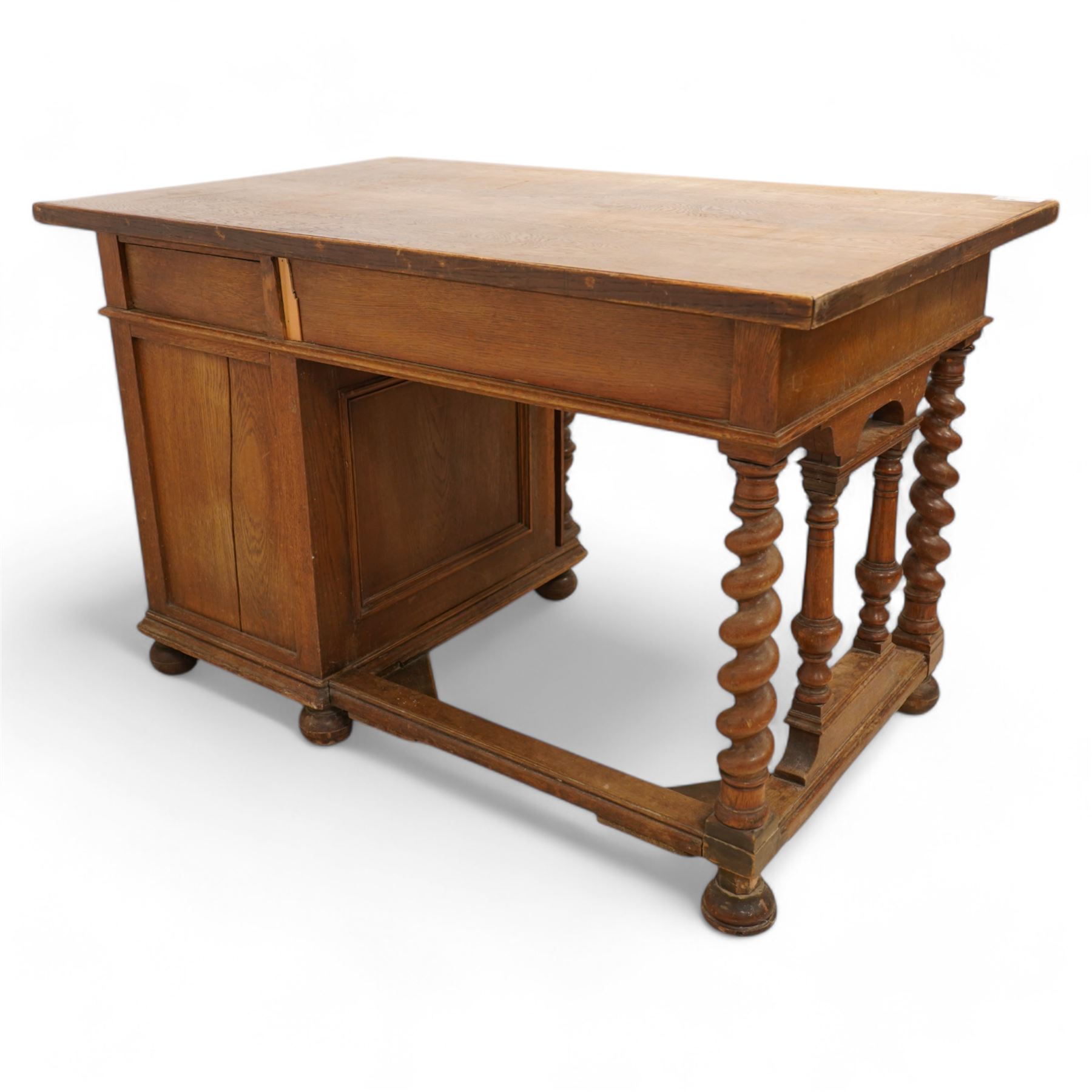 19th century oak desk, rectangular top over two drawers and cupboard, on spiral turned supports and turned bun feet