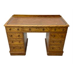 Victorian satin walnut twin pedestal desk, moulded rectangular top with rounded corners and raised back, inset leather writing surface with tooled borders, fitted with nine drawers with turned handles, on moulded plinth base 