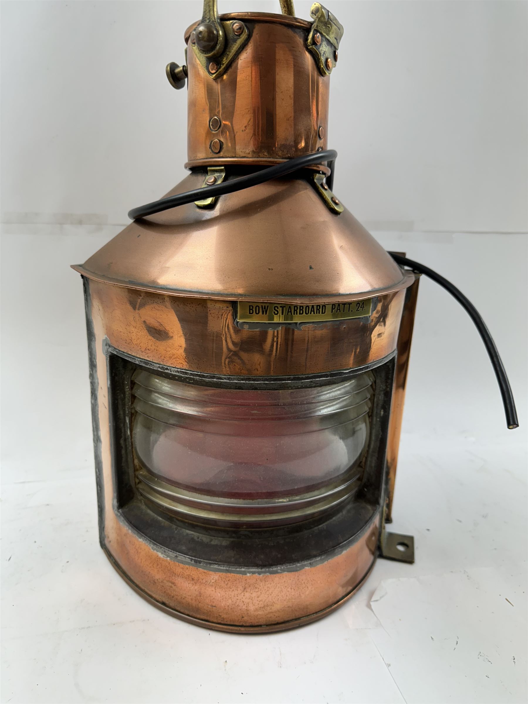 1940s copper and brass ship's corner lamp, converted to electricity, with applied plaque inscribed bow starboard patt.24, dated 1944, including handle H46cm 