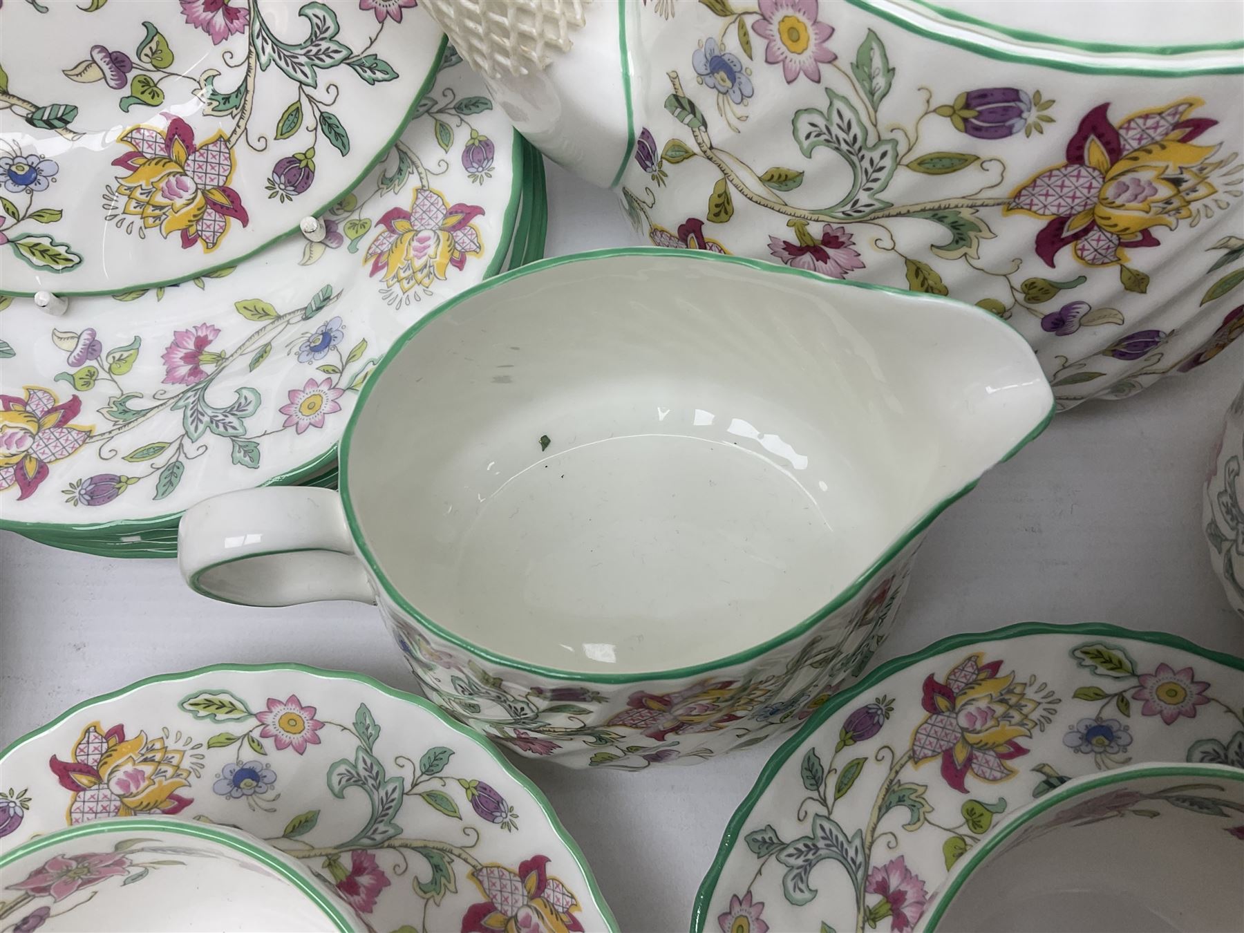 Minton Haddon Hall pattern tea service for twelve place settings, to include teapot, sugar bowl, milk jug, twelve cups and saucers and twelve dessert plates (39)