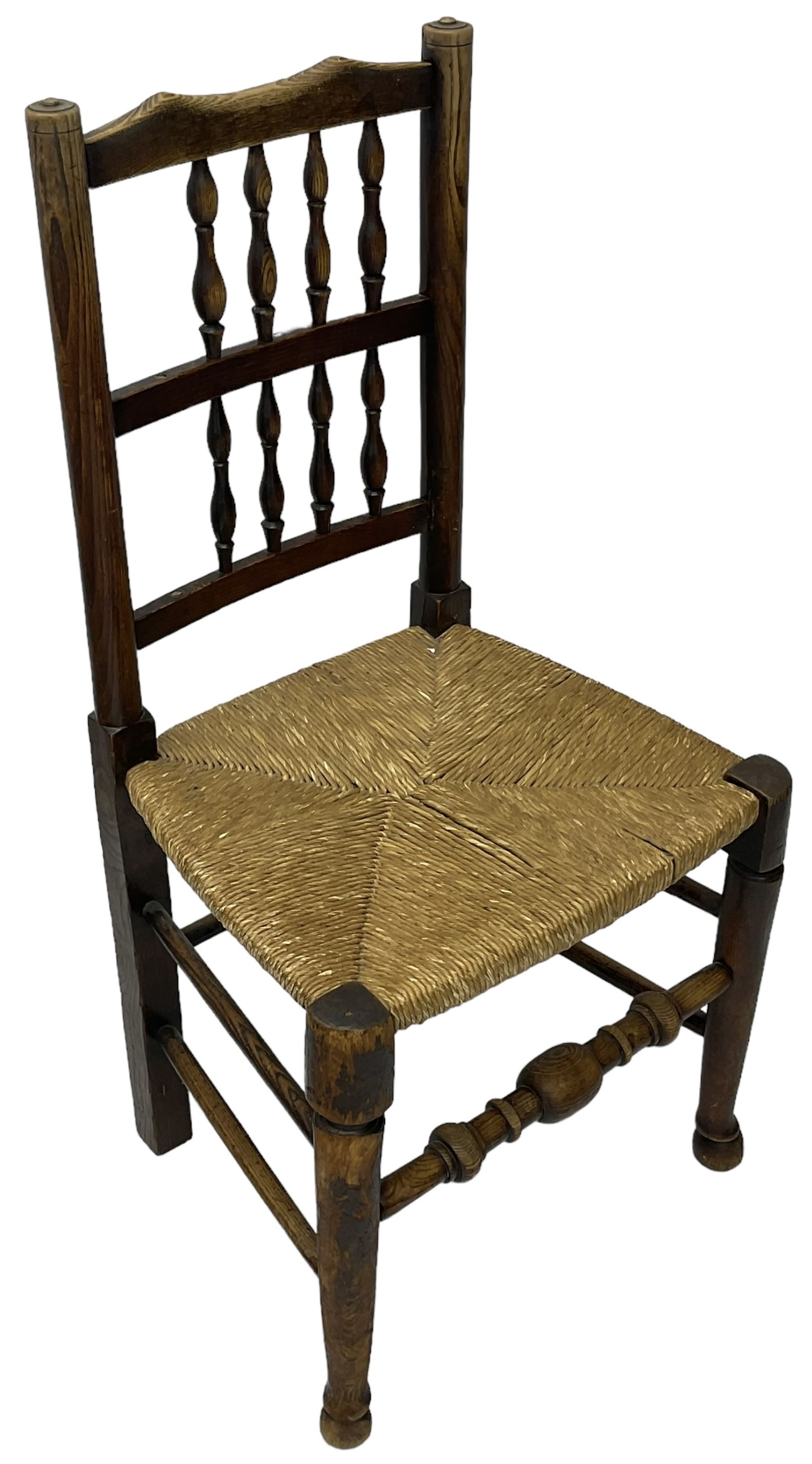 Collection of chairs - five 19th century elm spindle back chairs with rush seats; two chapel chairs (7)