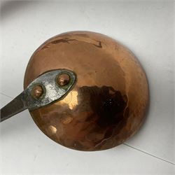 Large 19th century copper slotted spoon, with pierced flat bowl, L55cm, together with two 19th century iron handled ladles with circular copper bowls, largest example L48.5cm, (3)