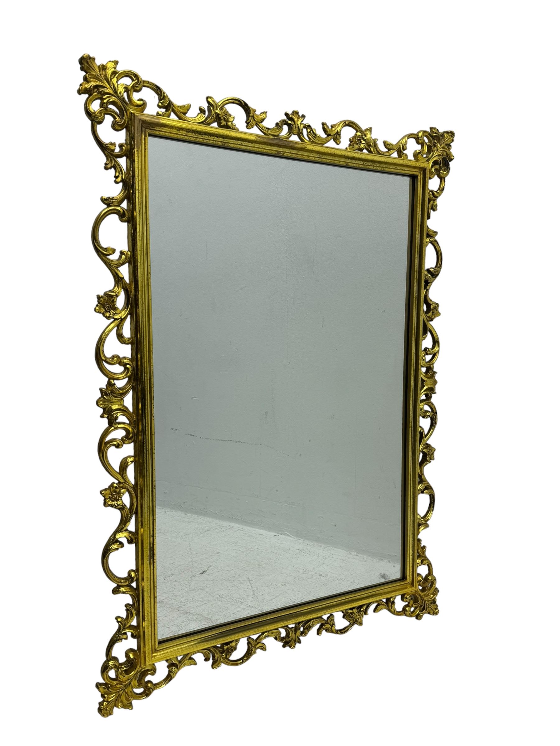 Large giltwood framed rectangular mirror, in Rococo revival design, scrolling foliate frame with gilt finish, plain glass plate