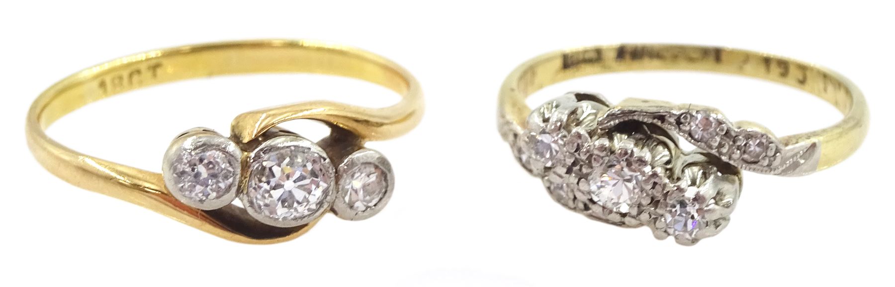 Early 20th century gold three stone old cut diamond crossover ring, stamped, total diamond weight approx 0.35 carat and one other gold three stone diamond crossover ring, with diamond set shoulders, both stamped 18ct