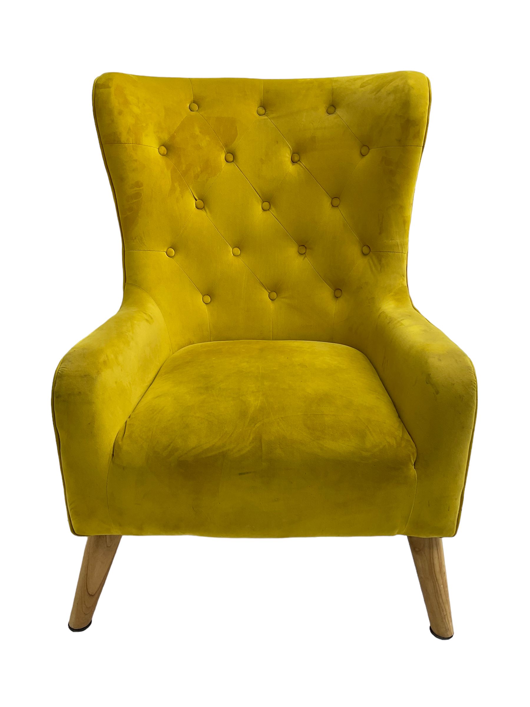 Mid-20th century design armchair, barrel back upholstered in buttoned mustard fabric, on tapering splayed front feet