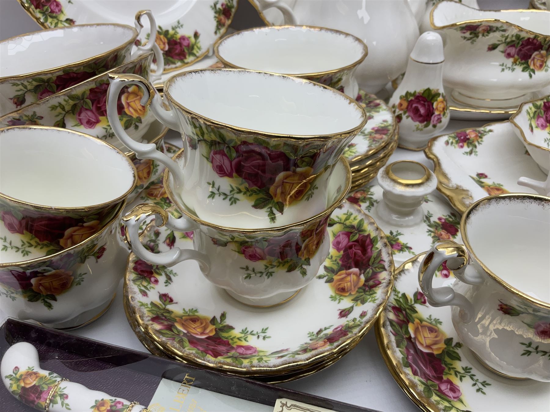 Royal Albert Old Country Roses pattern coffee service for six, comprising coffee pot, milk jug, cups and saucers, cake plate, together with miniature teapot, six teacups and saucers, six dinner plates, six side plates etc 