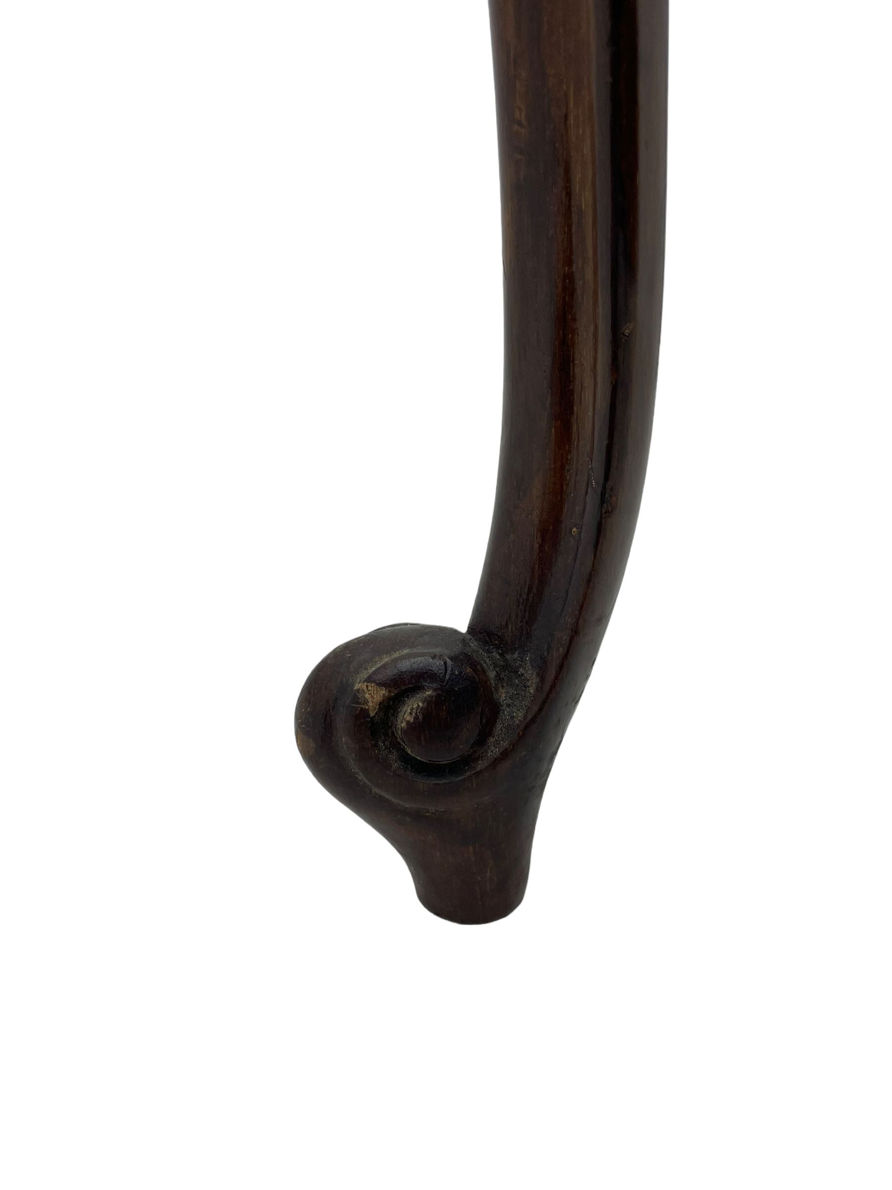 Early 20th century mahogany centre table, shaped moulded top over shaped frieze rails decorated with blind fretwork, on C-scroll and acanthus leaf carved cabriole supports with scrolled terminals 