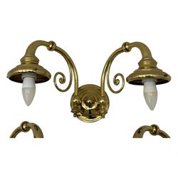 Two brass double-arm wall mounted lights, each with frosted glass globes and scrolled arms (W50cm, D26cm, H31cm); matching central double-arm light with candle-style fittings (W42cm, D24cm, H22cm)