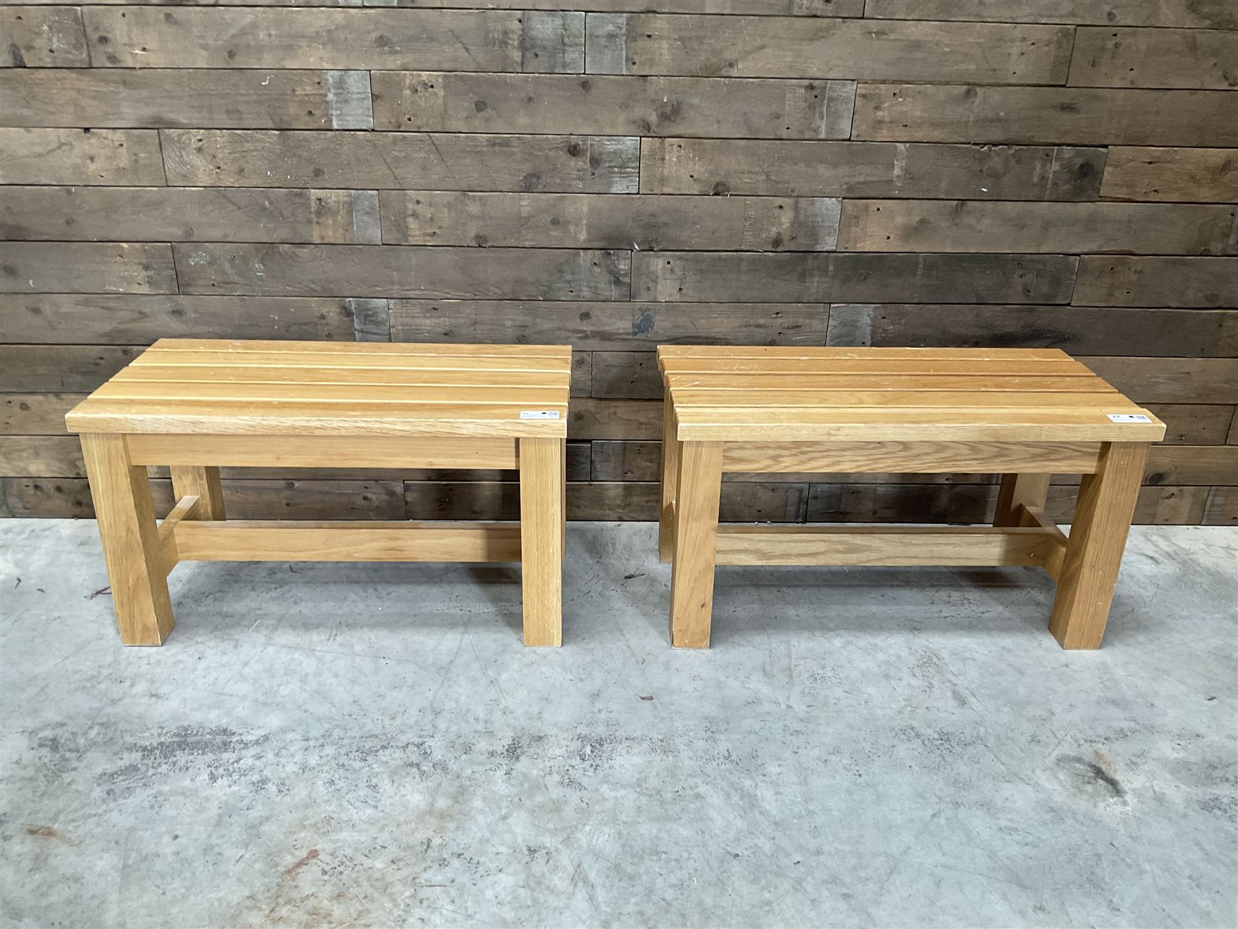 Three small light oak benches and a large bench