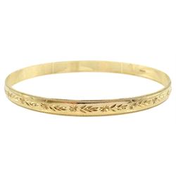 9ct gold bangle with engraved decoration, hallmarked