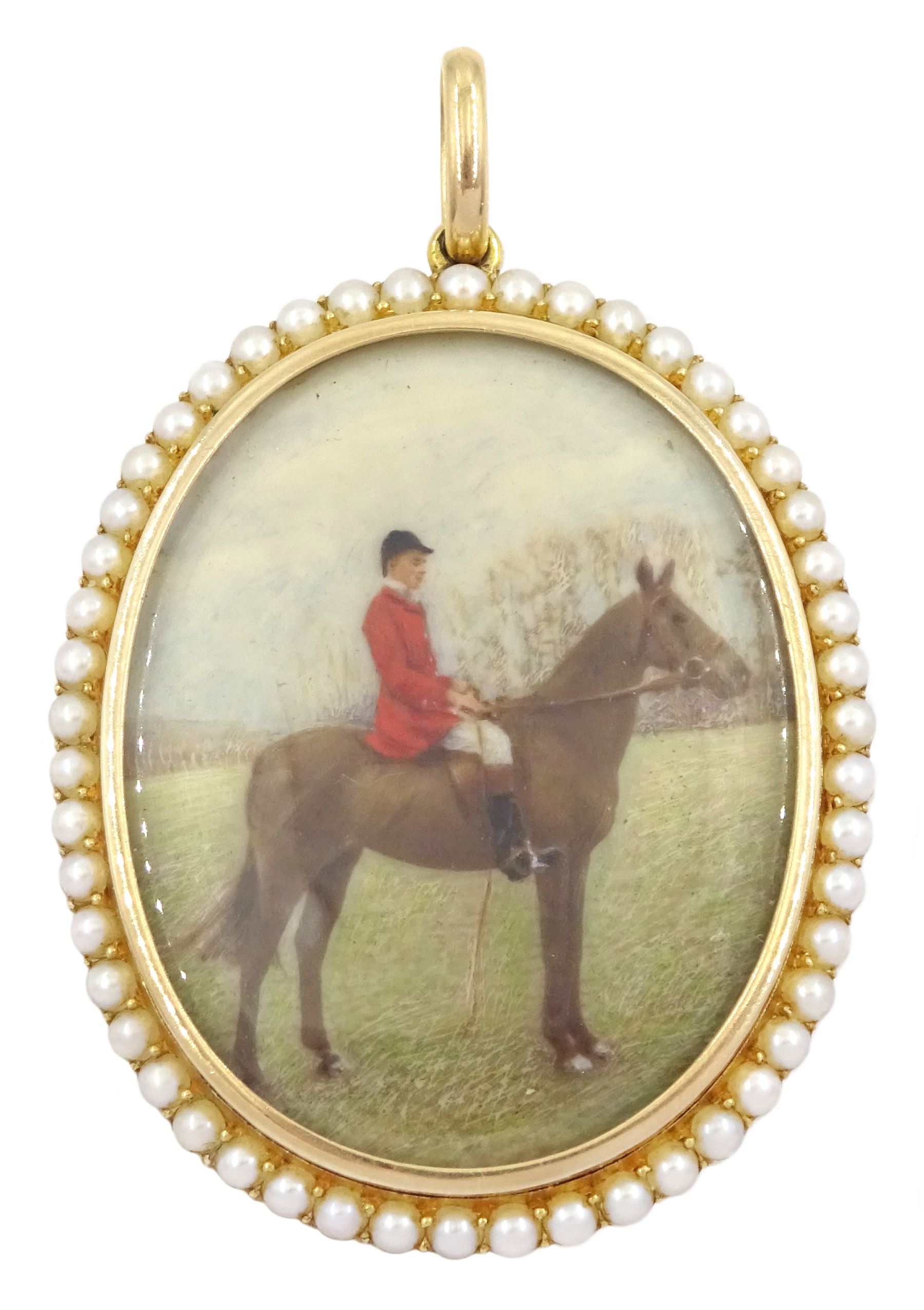 Early 20th century 15ct gold seed pearl locket pendant, with later overpainted print of a huntsman on horseback