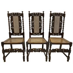 Set of seven (5+2) 19th century Carolean design oak dining chairs, scroll leaf and flower head carved cresting rail over spiral turned uprights and cane work back, the cane work seat on spiral turned supports united by plain stretchers, scrolled leaf carved middle rail 