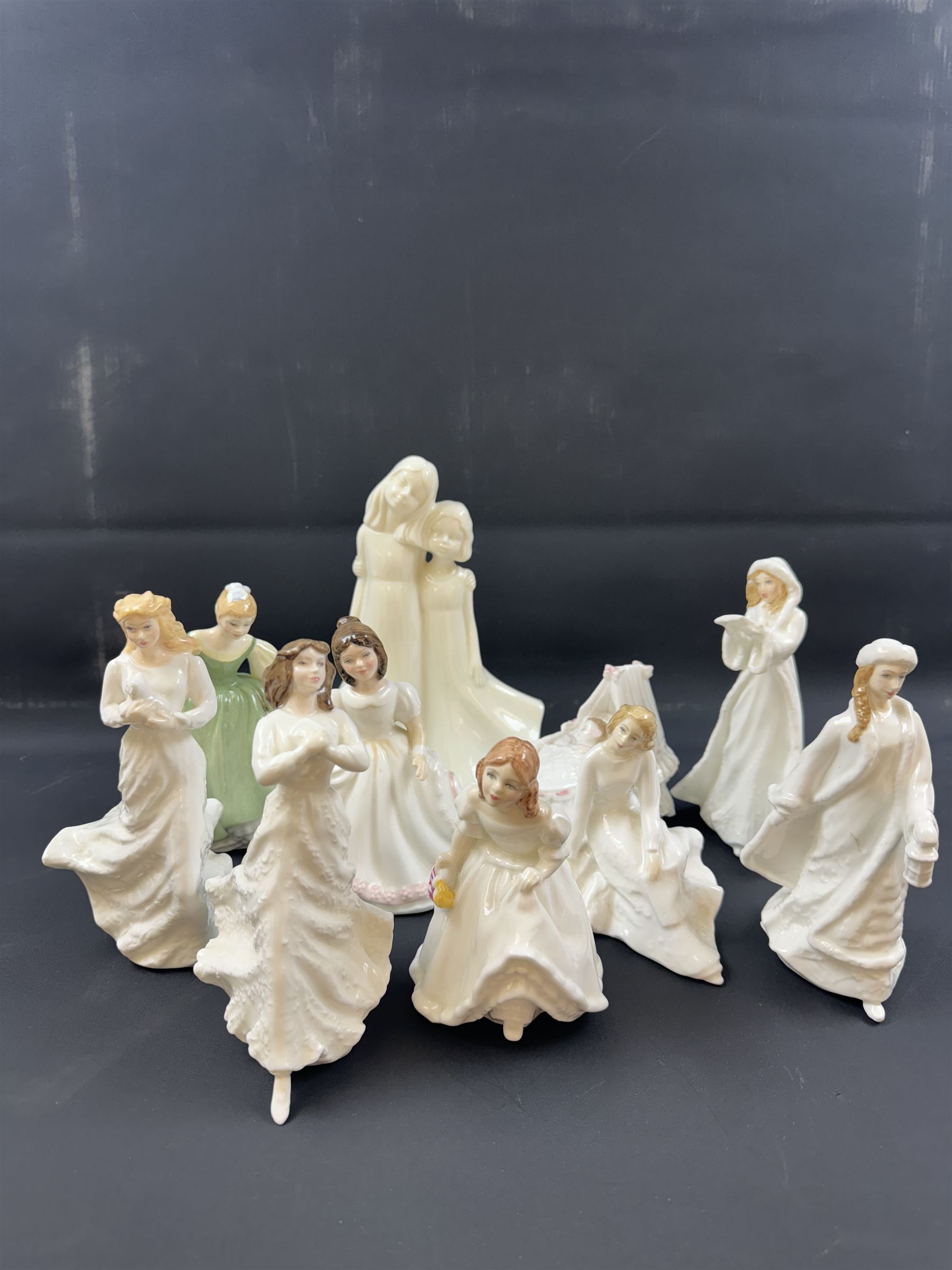 Eight Royal Doulton figures, including Fair Maiden, Across the Miles, Christmas Carols etc together with two Royal Worcester figures   