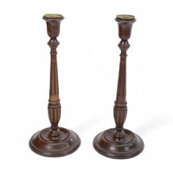 Pair of mahogany candlesticks, turned and fluted columns, upon stepped circular base, H37cm 