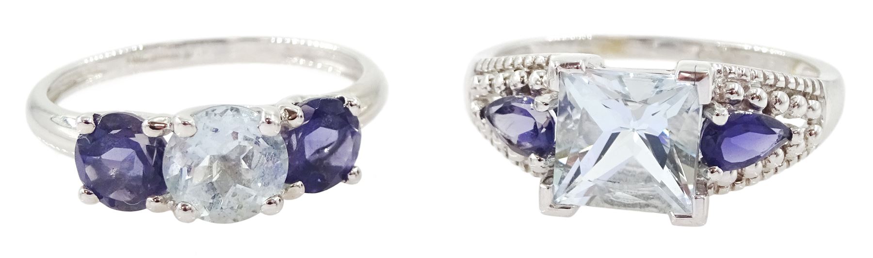 Two 9ct white gold three stone aquamarine and tanzanite rings, hallmarked