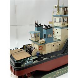 Modern model of American Coastal and River Tugboat 'Maya', in red, black and light blue finish, upon a green stand inscribed with name, H53cm, W52cm 