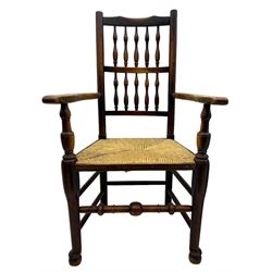 Matched set of twelve 19th century elm Lancashire spindleback dining chairs, shaped cresting rail over spindle back, rush seat, on turned supports united by turned stretchers, ring and globular turned front stretcher 