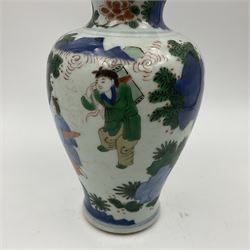 Chinese Wucai vase, of baluster form, decorated with an official and attendants in a garden setting, with crane, fence and rockwork, H19cm