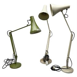 Three angle poise lamps, comprising green painted example and two white painted examples, tallest H84cm