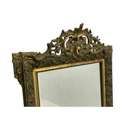 Victorian giltwood and gesso wall mirror, pierced shell cartouche pediment decorated with C-scrolls and curled leaves, moulded frame with curled acanthus leaf decoration and beaded inner slip, the corner brackets decorated with flower heads 