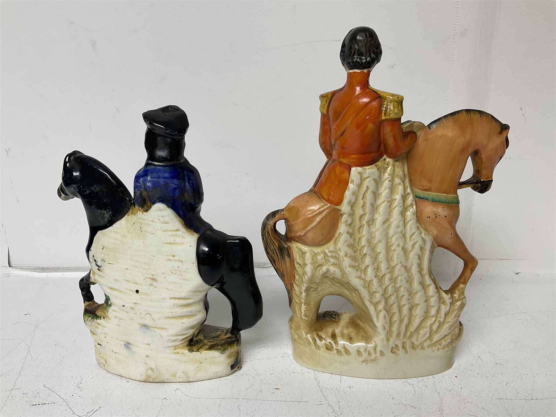 Staffordshire figure of the Duke of Wellington on a bay horse, H30cm in red uniform, together with a similar Staffordshire figure of Dick Turpin, pair of Staffordshire style dogs, H27cm, three Meissen style double salts and two trinket boxes 