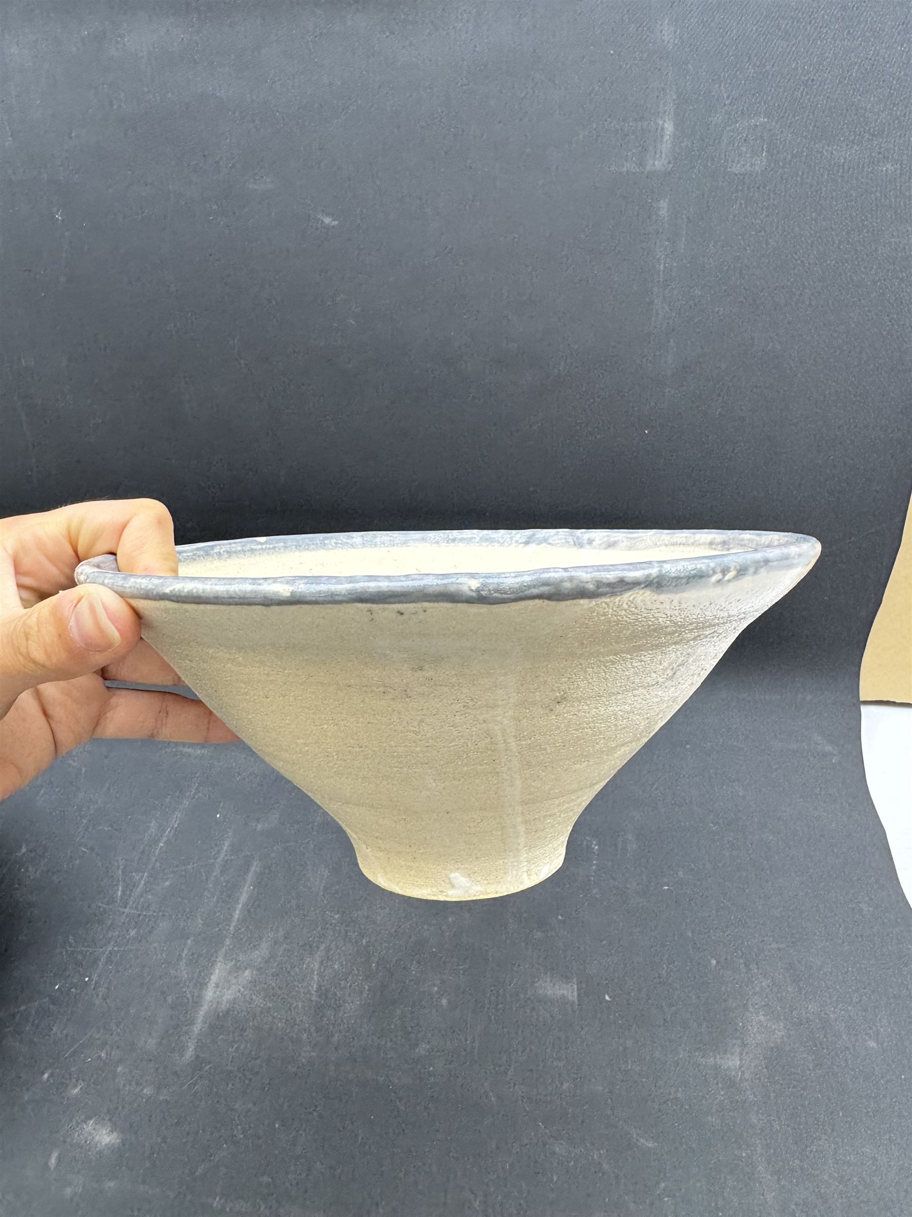 Studio pottery bowl of conical form, with blue band to the rim, together with Arwyn Jones dish, D20cm