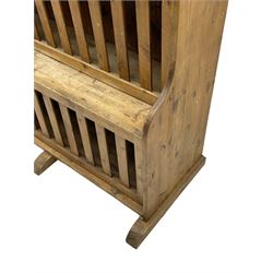 Waxed pine 'chicken coop' or 'hutch' dresser, projecting cornice over shaped frieze and three tier plate rack, the stepped waterfall lower section fitted with two slatted chicken coops, on sledge feet 