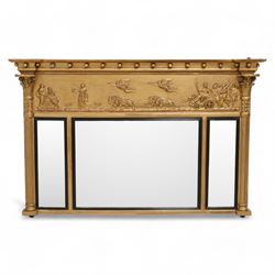 Regency gilt overmantle mirror, inverted breakfront pediment decorated with applied gilt s...