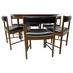 AH McIntosh & Co of Kirkaldy - mid-20th century teak extending dining table, circular top, concealed integrated double leaf, raised on tapered supports, label plaque to underside of leaf, together with a set of six chairs upholstered in black leatherette