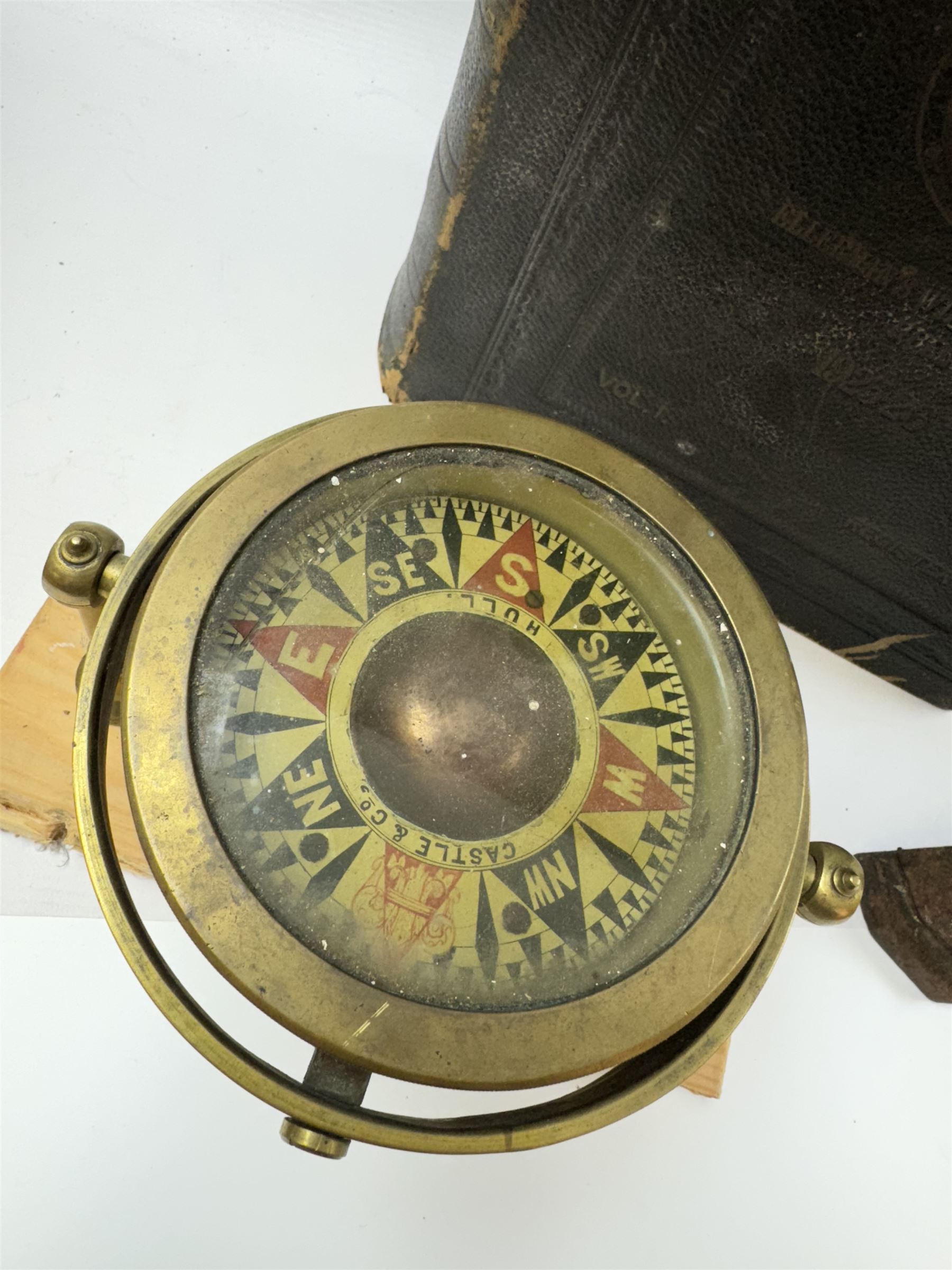 Collection of martime and shipping collectables, including brass cased gimbal compass, marked Castle & Co, Hull, cast iron Britains Pride doorstop, buttons, Lloyds Register, photographs, postcards and other ephemera