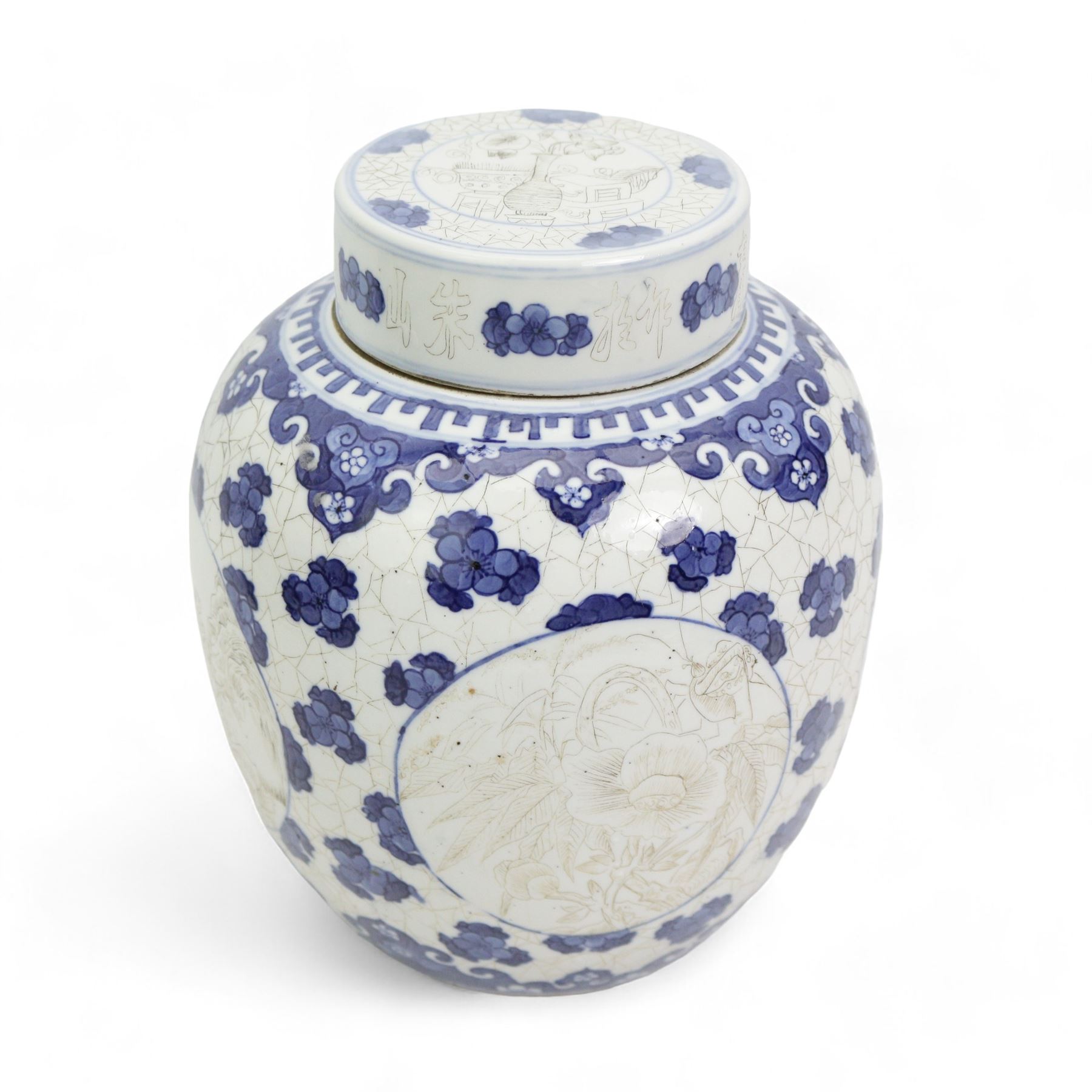 Chinese blue and white ginger jar, with sepia decoration, possibly unfinished, double ring mark beneath, H21cm, Chinese blue and white prunus pattern charger, D37.5cm, Japanese vase and a Chinese blue and white teapot, with associated cover and stand (4)