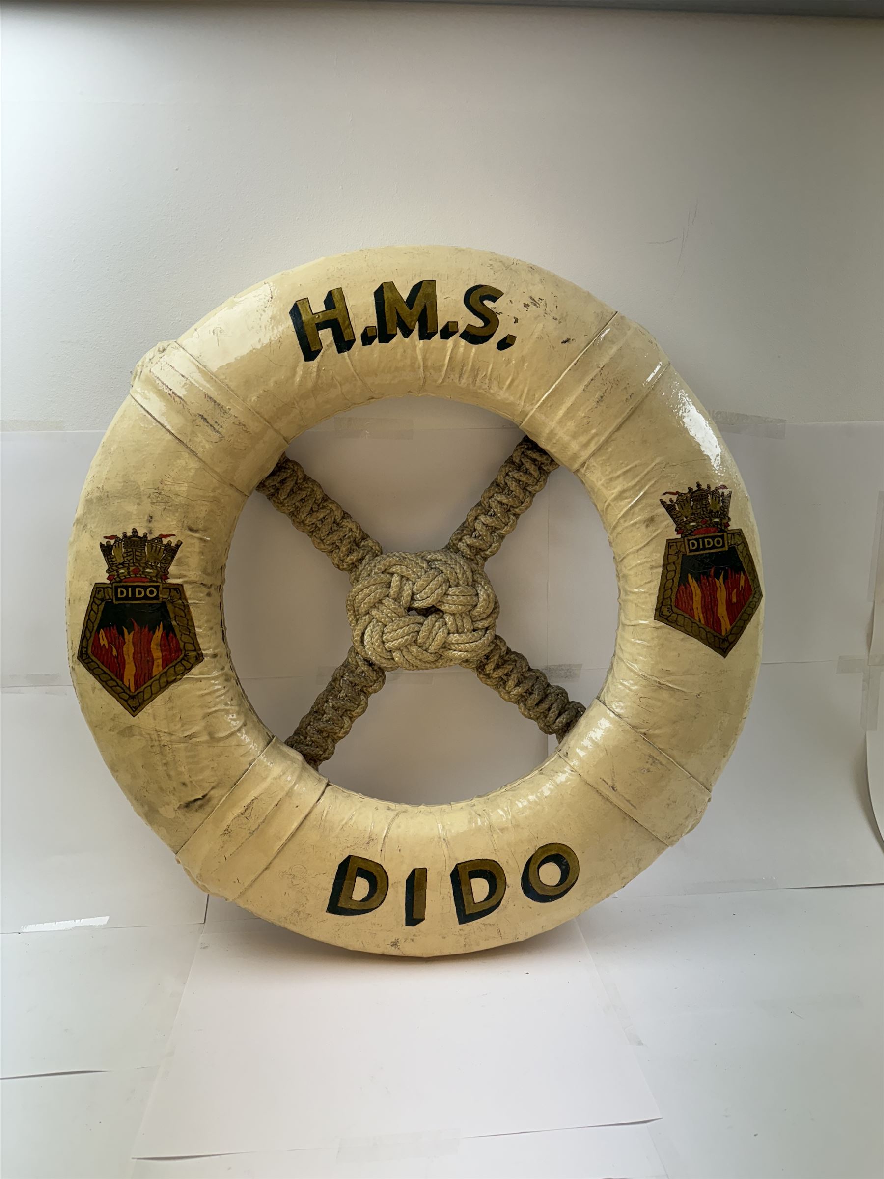 Late 19th/early 20th century ceremonial lifebuoy, from the Royal Navy light cruiser H.M.S Dido, the name painted in gilt lettering and with the ship's crest to either side, D74cm