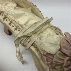 Pair of 19th century ivory silk satin ladies shoes, with rosette to the vamp, with pink silk satin heel, L23cm