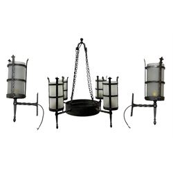 Wrought metal ceiling light, four branch with strapwork lanterns (D55cm); together with a pair of matching wall sconces (H32cm)