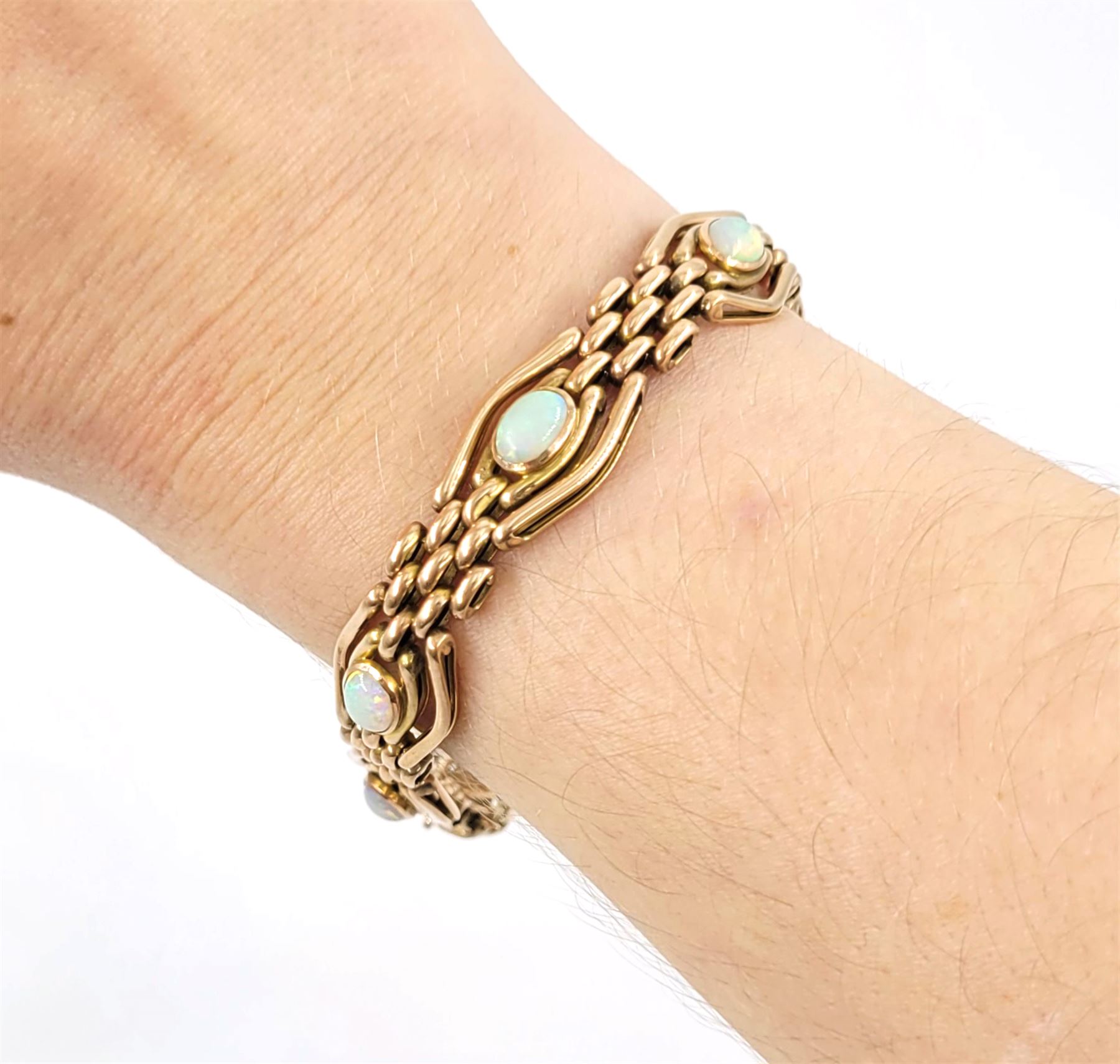 Early 20th century rose gold opal link bracelet, stamped 9ct