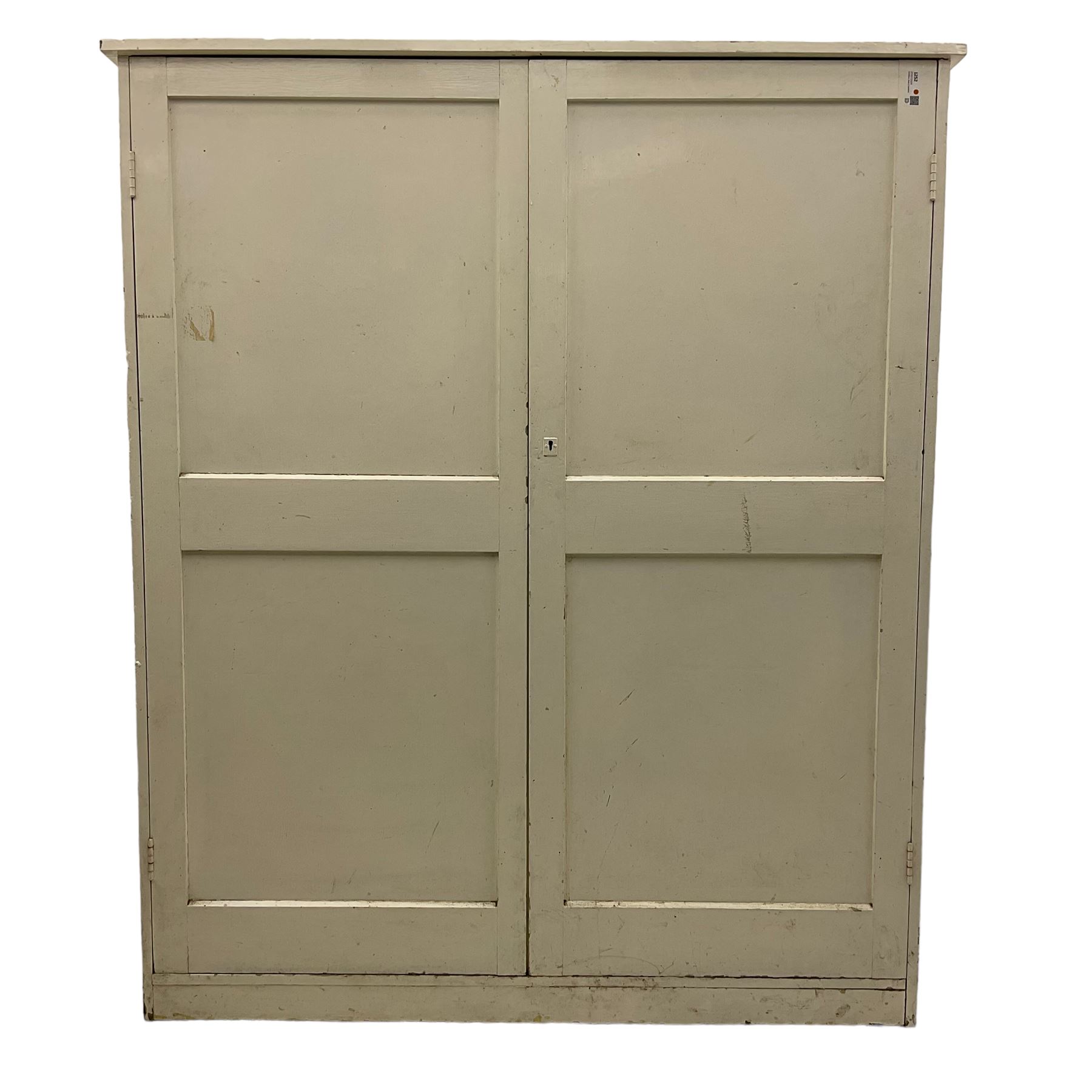 Large Victorian white painted pine cupboard, enclosed by two panelled doors 