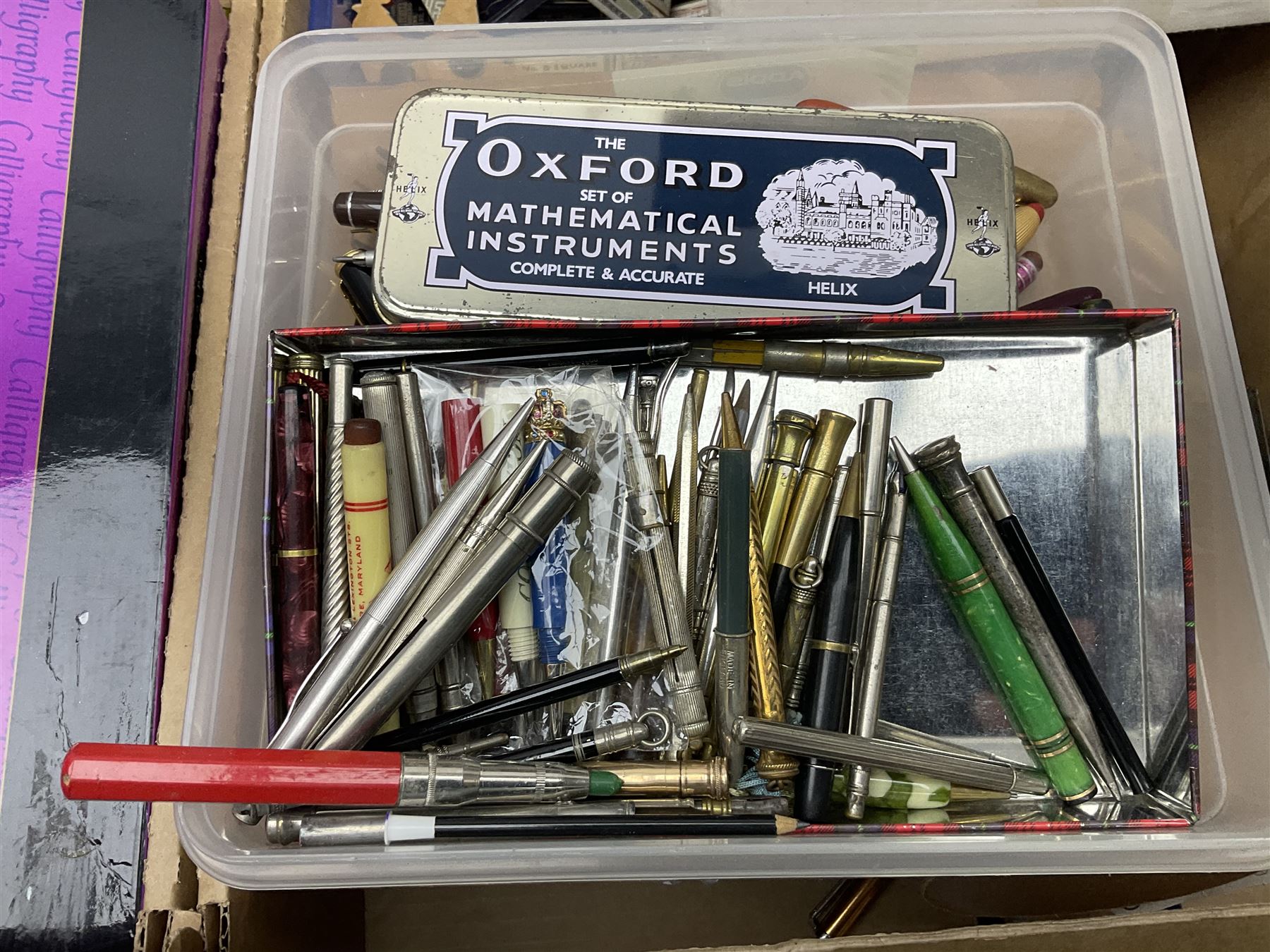 Large collection of calligraphy equipment, including pens, nibs and sets, together with other writing equipment and stationery, in three boxes