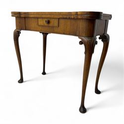 Edwardian mahogany fold-over card table, serpentine rectangular top opening to reveal a ba...