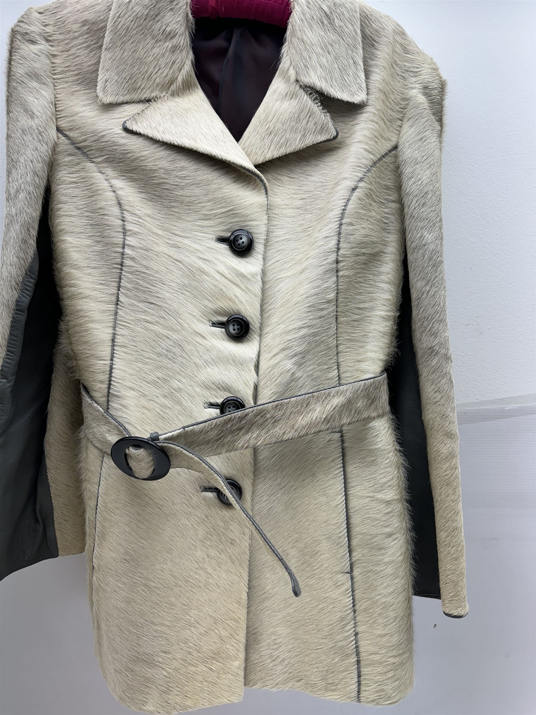 White pony hide, with grey leather sleeves and silk liner