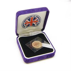 Queen Elizabeth II 2003 gold half sovereign coin, housed in a purple case