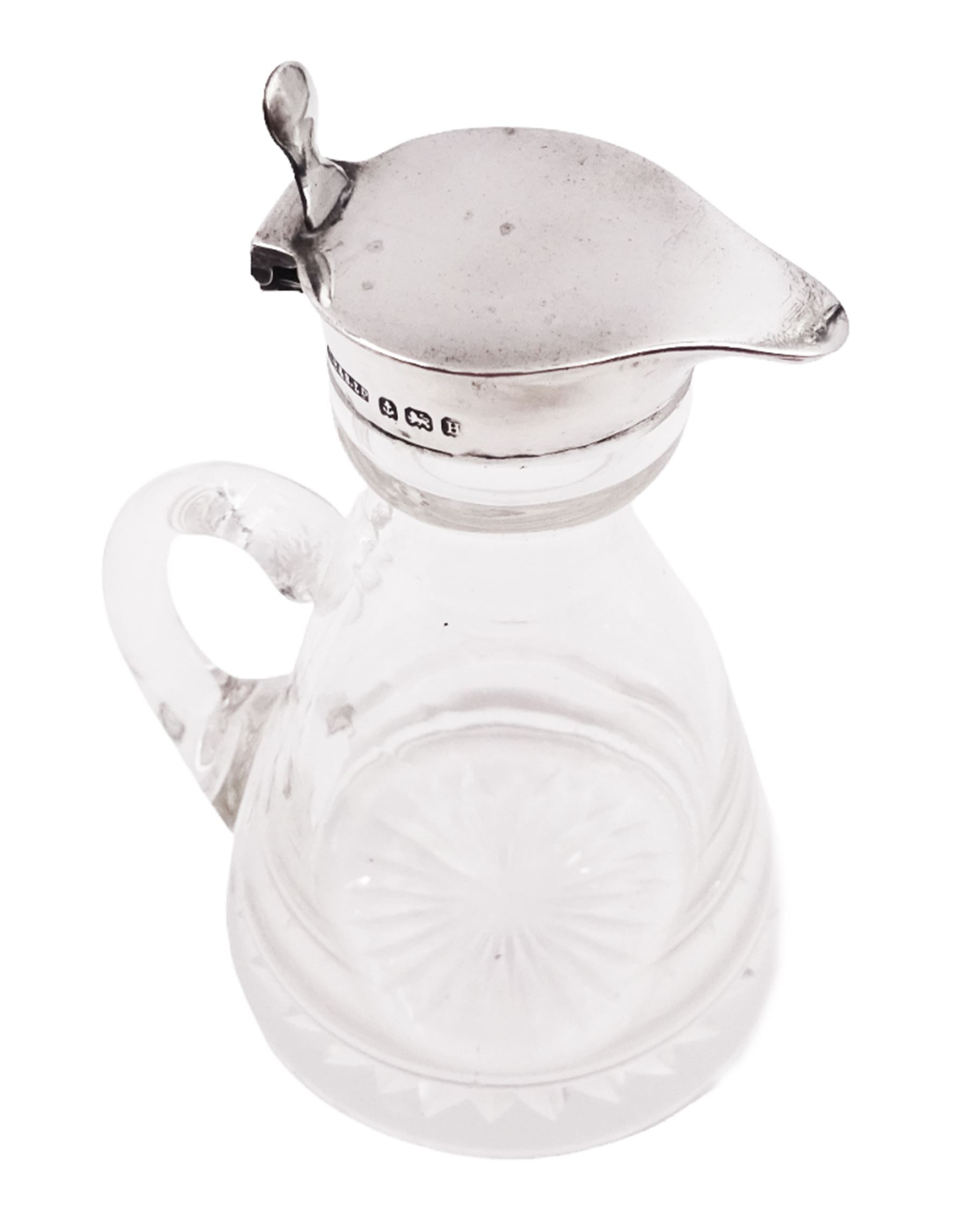 1930s silver mounted glass whiskey tot, with C handle and star cut base, the silver collar and cover with thumbpiece, hallmarked S Blanckensee & Son Ltd, Birmingham 1932, including thumbpiece H10.5cm