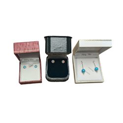 Three pairs of silver earrings, including a turquoise pair and two opal pairs, all boxed 