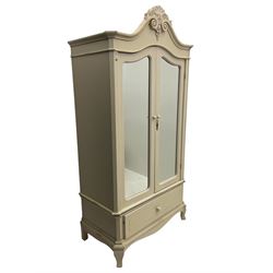 French design cream painted armoire wardrobe, shaped top with shell and flower head pediment, enclosed by two mirror glazed doors, the base fitted with single drawer