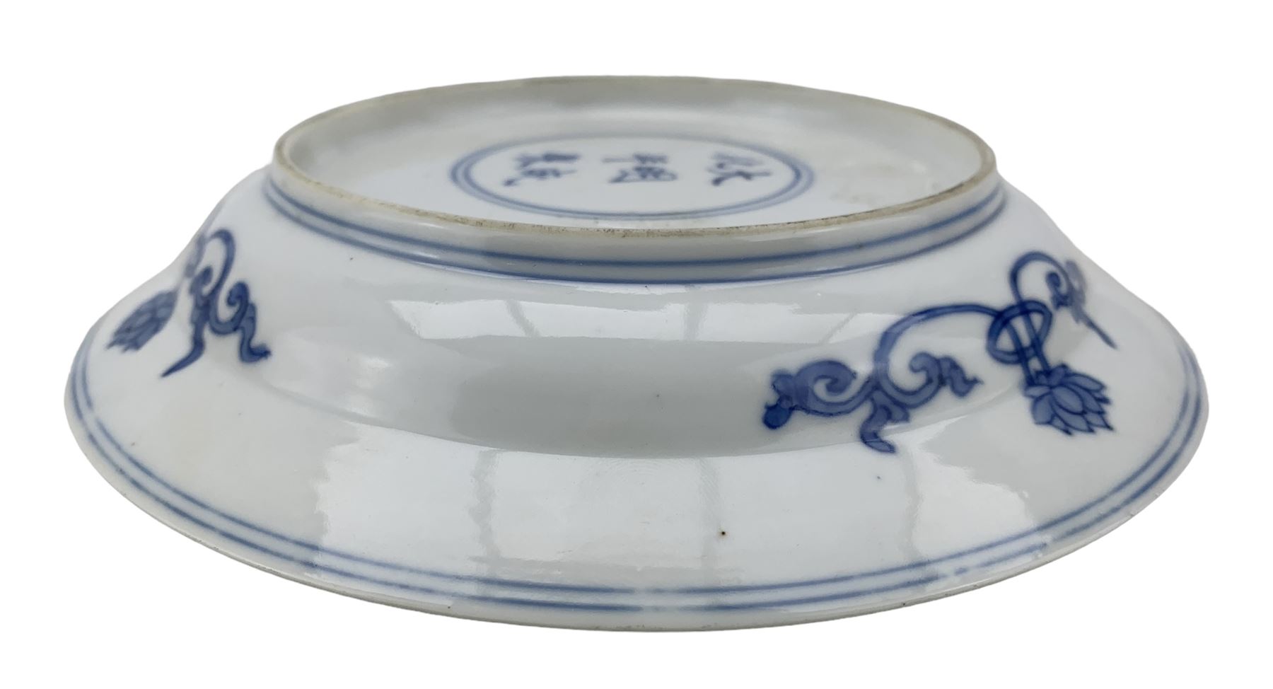 Chinese porcelain dish, Kangxi period, decorated with three shou characters divided by flowers, ribbon tied cash and swastikas, the border with flowerheads in roudels, six character Chenghua mark beneath, D16.5cm 