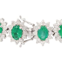 18ct white gold oval emerald and round brilliant cut diamond cluster bracelet, stamped 750, total emerald weight 14.70 carat, total diamond weight 7.24 carat